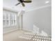 Bedroom with carpet, windows with shutter, and a ceiling fan at 710 Cox Rd, Roswell, GA 30075