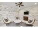 Bright bonus room features a ceiling fan, accent wall, and inviting decor at 710 Cox Rd, Roswell, GA 30075