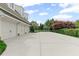 Long driveway leading to a three-car garage, complemented by a basketball hoop for outdoor recreation at 710 Cox Rd, Roswell, GA 30075