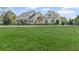 Spacious lawn and landscaping complement this beautiful two-story home with a basketball hoop at 710 Cox Rd, Roswell, GA 30075