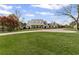 Charming two-story home featuring a well-manicured lawn and a circular driveway at 710 Cox Rd, Roswell, GA 30075
