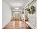 Spacious foyer with hardwood floors, a stylish light fixture, and an inviting bench at 710 Cox Rd, Roswell, GA 30075