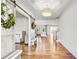Bright foyer features hardwood floors, a sliding barn door, and a view into the living area at 710 Cox Rd, Roswell, GA 30075