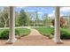 View from the porch of a manicured lawn with beautiful landscaping at 710 Cox Rd, Roswell, GA 30075