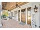 Welcoming front porch featuring a swing, wooden ceiling, and stylish decor at 710 Cox Rd, Roswell, GA 30075