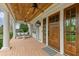 Inviting front porch with swing seating and detailed ceiling at 710 Cox Rd, Roswell, GA 30075