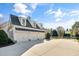 Spacious three-car garage with an attached basketball court, offering ample parking and recreational space at 710 Cox Rd, Roswell, GA 30075