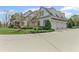 Spacious three-car garage with an expansive driveway, surrounded by manicured landscaping at 710 Cox Rd, Roswell, GA 30075