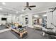 Home gym with exercise equipment, weights, and mirrors reflecting a second workout area at 710 Cox Rd, Roswell, GA 30075