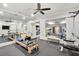 An expansive home gym featuring modern machines, mirrored walls, and ample space for fitness activities at 710 Cox Rd, Roswell, GA 30075