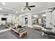 Well-equipped home gym with mirrored walls and a variety of fitness machines at 710 Cox Rd, Roswell, GA 30075