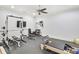 Bright home gym showcasing weightlifting equipment and mounted TVs for entertainment during workouts at 710 Cox Rd, Roswell, GA 30075