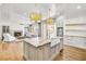 Bright kitchen featuring a large island, farmhouse sink, and stainless steel appliances at 710 Cox Rd, Roswell, GA 30075