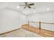 Second floor landing with hardwood floors and white wooden banister with access to rooms at 710 Cox Rd, Roswell, GA 30075