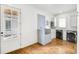 Laundry room featuring a dog wash station, cabinets, modern washer and dryer, and natural light at 710 Cox Rd, Roswell, GA 30075
