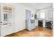 Bright laundry room boasts stainless steel washer and dryer and convenient tiled dog washing station at 710 Cox Rd, Roswell, GA 30075