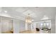 Spacious living room features an eye-catching decorative lighting fixture and a cozy seating area at 710 Cox Rd, Roswell, GA 30075