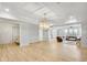 Expansive living room features wood floors, recessed lighting, and opens to the kitchen at 710 Cox Rd, Roswell, GA 30075