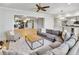 Expansive living room featuring a sectional sofa and view to a bonus room with exercise equipment and a bar area at 710 Cox Rd, Roswell, GA 30075