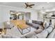Spacious living room with a large sectional, area rug, and an open floor plan at 710 Cox Rd, Roswell, GA 30075