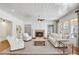 Bright living room with fireplace, built-ins, and hardwood floors at 710 Cox Rd, Roswell, GA 30075