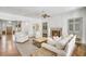 Cozy living room with fireplace, hardwood floors and open entry hall at 710 Cox Rd, Roswell, GA 30075