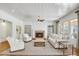 Spacious living room with brick fireplace, and many windows providing natural light at 710 Cox Rd, Roswell, GA 30075