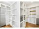 Mudroom complete with built-in shelving and storage; adjacent to kitchen at 710 Cox Rd, Roswell, GA 30075