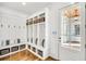 Functional mudroom with built-in storage, hooks, bench seating, and easy access to the entryway at 710 Cox Rd, Roswell, GA 30075