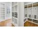 Well-organized mudroom with custom built-in storage, bench seating, and ample shelving at 710 Cox Rd, Roswell, GA 30075