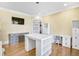 Well-lit office space boasts a white desk, ample storage, and a 'Be Nice or Leave' sign at 710 Cox Rd, Roswell, GA 30075