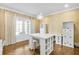Bright office features ample storage, white furniture, hardwood floors, and bright, natural light at 710 Cox Rd, Roswell, GA 30075