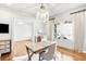 Bright home office with hardwood floors, desk, and plenty of natural light at 710 Cox Rd, Roswell, GA 30075