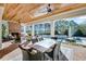 Inviting outdoor living space with a fireplace, ample seating, and a view of the pool at 710 Cox Rd, Roswell, GA 30075