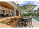Beautiful outdoor entertaining space with a pool, patio, and outdoor kitchen, ideal for gatherings at 710 Cox Rd, Roswell, GA 30075