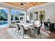 Covered patio with a large dining table and comfortable seating, perfect for outdoor entertaining at 710 Cox Rd, Roswell, GA 30075