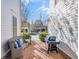 Inviting patio with wicker furniture and a grill, perfect for outdoor entertaining and relaxation at 710 Cox Rd, Roswell, GA 30075
