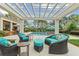 Inviting outdoor patio with a pergola, comfortable seating, and a view of the sparkling swimming pool at 710 Cox Rd, Roswell, GA 30075
