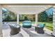 Stylish pergola featuring plush outdoor seating, creating a cozy and inviting space for relaxation and conversation at 710 Cox Rd, Roswell, GA 30075