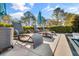 Relaxing poolside with comfortable lounge chairs and umbrellas, offering the perfect spot for outdoor relaxation at 710 Cox Rd, Roswell, GA 30075