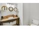 Unique powder room featuring a custom vanity and decorative mirrors at 710 Cox Rd, Roswell, GA 30075