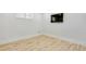 Empty room with hardwood flooring and white trim at 710 Cox Rd, Roswell, GA 30075