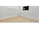 Bright room featuring wood-look flooring and ample natural light from a window at 710 Cox Rd, Roswell, GA 30075