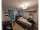 This bedroom features a ceiling fan, a window, and a closet at 405 Baneberry Bnd, Peachtree City, GA 30269