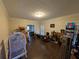Open-concept living room featuring hardwood floors and abundant natural light at 405 Baneberry Bnd, Peachtree City, GA 30269