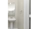 Small bathroom with pedestal sink and mirror at 527 Firethorn Ct, Villa Rica, GA 30180
