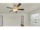 Bright bedroom featuring a ceiling fan and en-suite bathroom at 527 Firethorn Ct, Villa Rica, GA 30180