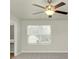 Bedroom with a window, ceiling fan and neutral walls at 527 Firethorn Ct, Villa Rica, GA 30180