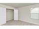 Bedroom with double door closet and window at 527 Firethorn Ct, Villa Rica, GA 30180