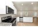 White cabinets, granite countertops, and stainless steel appliances at 527 Firethorn Ct, Villa Rica, GA 30180